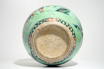 A Chinese famille verte green-ground fish bowl with warriors on horseback, 19th C.