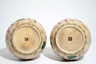 A pair of Chinese crackle-glazed bottle vases with kylins and elephants, 19th C.