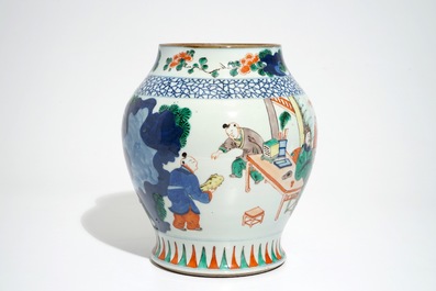 A Chinese olive-shaped wucai vase with figures, 19th C.