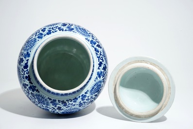 A tall Chinese blue and white baluster jar and cover with lotus scrolls, Kangxi