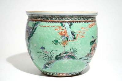 A Chinese famille verte green-ground fish bowl with warriors on horseback, 19th C.