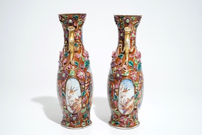 A pair of Chinese famille rose relief-decorated mandarin vases, Qianlong