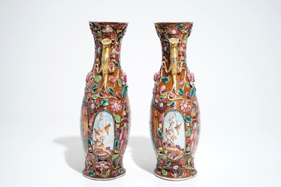 A pair of Chinese famille rose relief-decorated mandarin vases, Qianlong