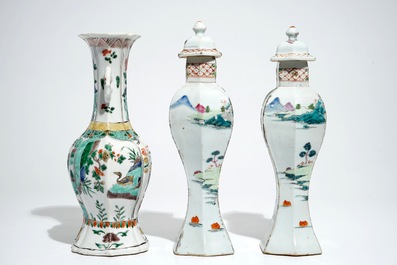 A Chinese famille verte vase with animals, Kangxi, with a pair of famille rose vases and covers, Qianlong