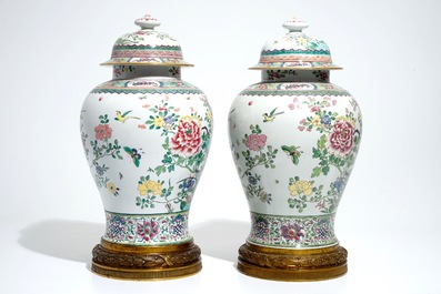 A pair of tall bronze-mounted famille rose baluster vases and covers, Samson, Paris, 19th C.