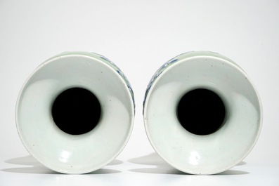 A pair of Chinese celadon-ground vases with blue and white figures, 19th C.