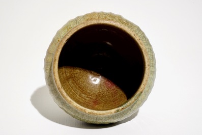 A Chinese Longquan celadon-ground crackle-glazed jar and two dishes, Ming