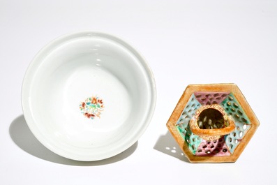 A Chinese reticulated double-walled famille rose tea bowl and a basket, Yongzheng