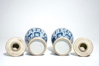 A pair of Chinese blue and white vases and covers with grapes, Kangxi