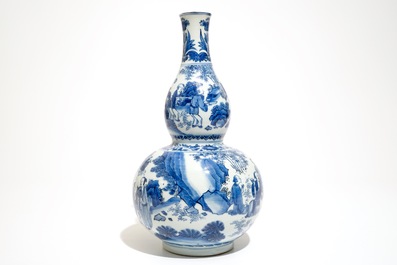 A Chinese blue and white double gourd vase with scholars, Transitional period, Chongzhen