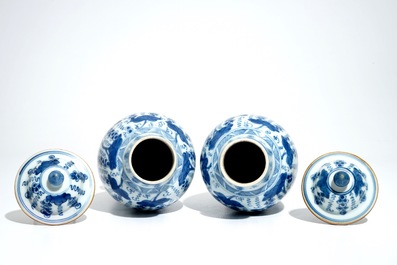 A pair of Chinese blue and white vases and covers with grapes, Kangxi