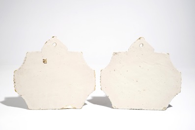 A pair of fine Dutch Delft blue and white plaques with travellers, 18th C.