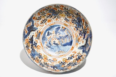 A Chinese clobbered blue and white kraak porcelain bowl with floral design, Wanli