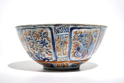 A Chinese clobbered blue and white kraak porcelain bowl with floral design, Wanli