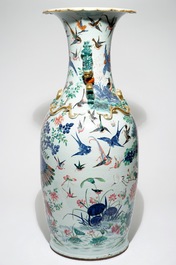 A very large Chinese famille rose vase with a peacock, 19th C.