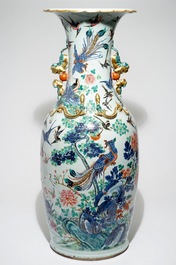 A very large Chinese famille rose vase with a peacock, 19th C.