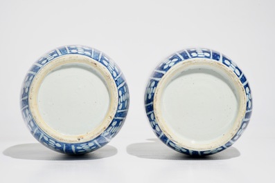 A pair of Chinese blue and white rouleau vases with landscape design, 19th C.