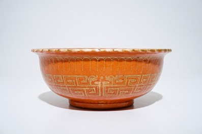 A Chinese coral-glazed and gilt bowl, Daoguang mark, 19th C.