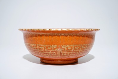 A Chinese coral-glazed and gilt bowl, Daoguang mark, 19th C.