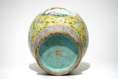 A tall Chinese famille rose yellow-ground vase with a tiger, Qianlong mark, 19th C.