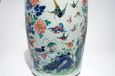 A very large Chinese famille rose vase with a peacock, 19th C.
