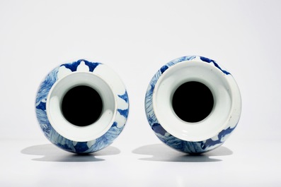 A pair of Chinese blue and white rouleau vases with landscape design, 19th C.
