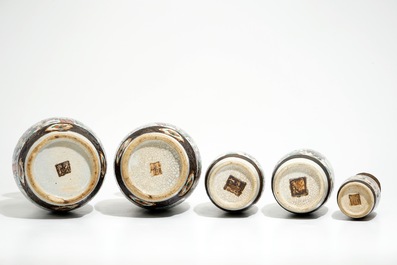 Two pairs of Chinese Nanking famille rose vases and a smaller one, 19/20th C.