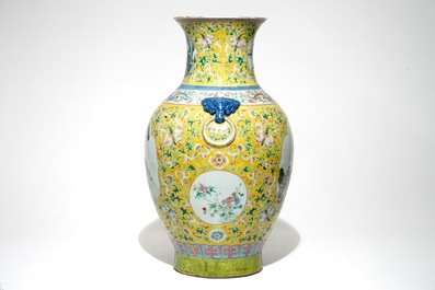 A tall Chinese famille rose yellow-ground vase with a tiger, Qianlong mark, 19th C.