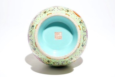A Chinese famille rose on lime green-ground vase, Qianlong mark, 20th C.