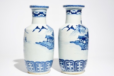 A pair of Chinese blue and white rouleau vases with landscape design, 19th C.