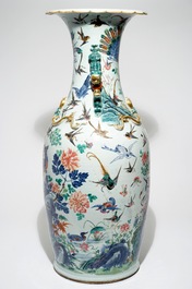 A very large Chinese famille rose vase with a peacock, 19th C.