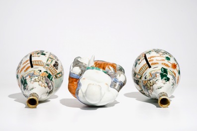 A pair of Chinese famille verte double gourd vases and a Buddha, 19/20th C.