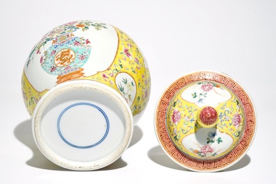 A Chinese famille rose baluster vase and cover with design of a flowervase, 19th C.