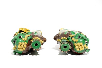A pair of Chinese verte biscuit joss stick holders shaped as Buddhist lions, Kangxi