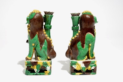 A pair of Chinese verte biscuit joss stick holders shaped as Buddhist lions, Kangxi