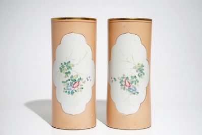 A pair of Chinese famille rose salmon pink-ground hat stands and a blue and white charger, 19/20th C.