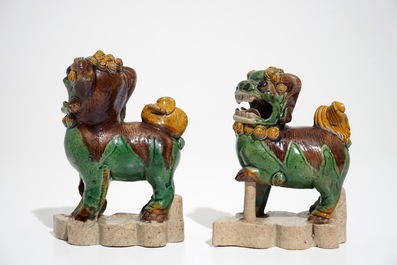 A pair of Chinese verte biscuit models of Buddhist lions, Kangxi