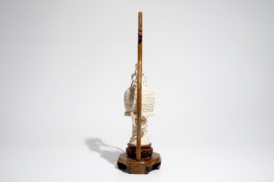 A Chinese encrusted ivory vase on wooden stand, early 20th C.