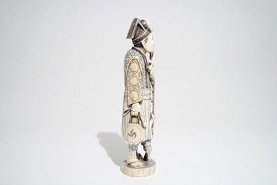 A Japanese ivory okimono of a pipesmoker, Meiji/Taisho, early 20th C., signed