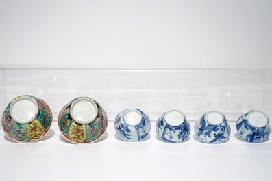 A pair of Chinese famille verte cups and saucers and four blue and white cups, Kangxi