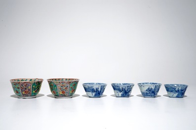 A pair of Chinese famille verte cups and saucers and four blue and white cups, Kangxi