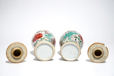 A pair of Chinese famille rose covered vases and four saucers, Yongzheng/Qianlong