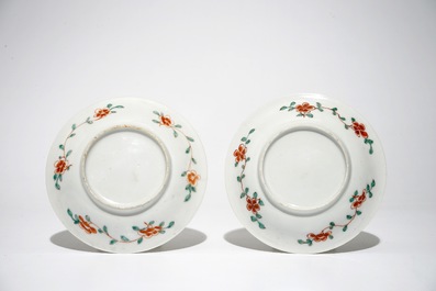 A pair of Chinese famille verte cups and saucers and four blue and white cups, Kangxi