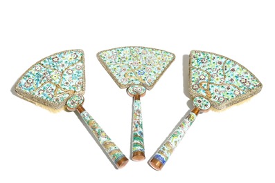 A Chinese enamelled silver and brass mirror and two brushes, 19/20th C.