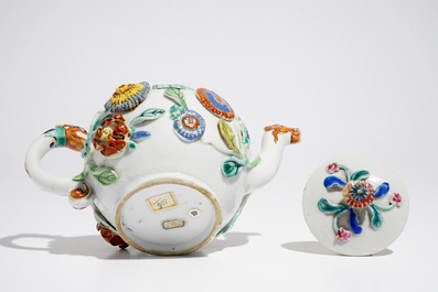 A Chinese famille rose teapot on stand with applied decoration, Yonzheng