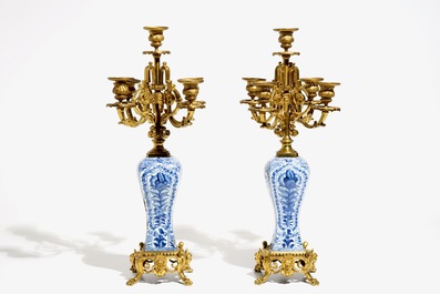 A pair of Chinese blue and white gilt bronze-mounted candelabra vases, Kangxi