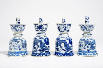Two pairs of Chinese blue and white candlesticks with dragons, 19/20th C.