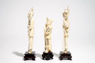 Three Chinese ivory figures on wooden bases, 1st half 20th C.