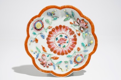 A Chinese famille rose teapot on stand with applied decoration, Yonzheng