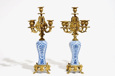 A pair of Chinese blue and white gilt bronze-mounted candelabra vases, Kangxi